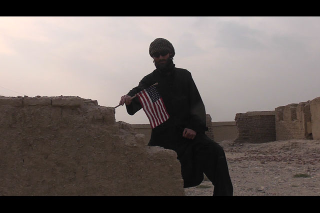 Matthew VanDyke sneaking into Osama bin Laden's destroyed house and placing an American flag in the ruins in Jalalabad Afghanistan