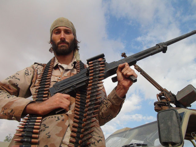 Freedom fighter Matthew VanDyke with the PKT machine gun he used in combat in Sirte Libya