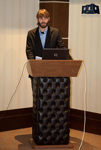 Matthew VanDyke giving a speech at the Libya Summit