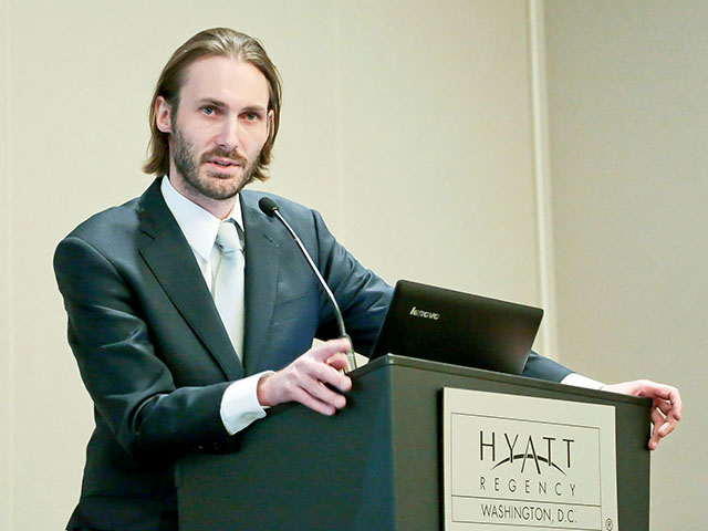 Matthew VanDyke giving a speech at the Syrian Women in the Revolution Conference